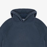 Close-up of a dark slate blue hooded sweatshirt showing the hood and upper chest area against a light gray background.