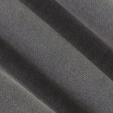 A close-up of dark gray textured fabric with soft diagonal folds showing the woven material detail.