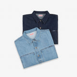 Two folded denim button-up shirts in light and dark blue washes, displayed on a clean white background. The brand name 'Dubbleware' is visible on the inner neck labels.