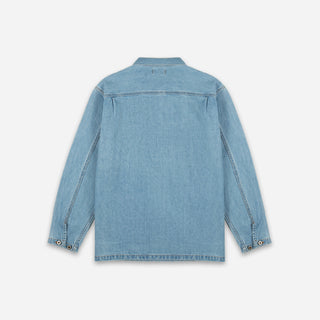 A light blue denim shirt jacket shown from the back, featuring a classic collar, long sleeves with buttoned cuffs, and a straight hem, photographed against a clean off-white background.