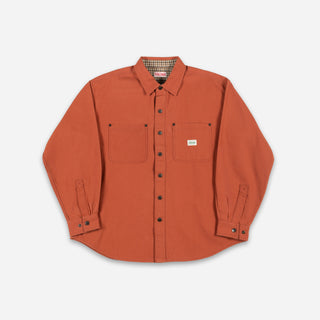 An orange long-sleeve button-up shirt with two chest pockets, laid flat on a light gray background.