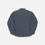 A dark slate blue long-sleeve button-up shirt shown from the back, laid flat against a light gray background.