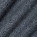 A close-up of dark slate blue-gray textured fabric with a fine woven pattern and soft diagonal folds.